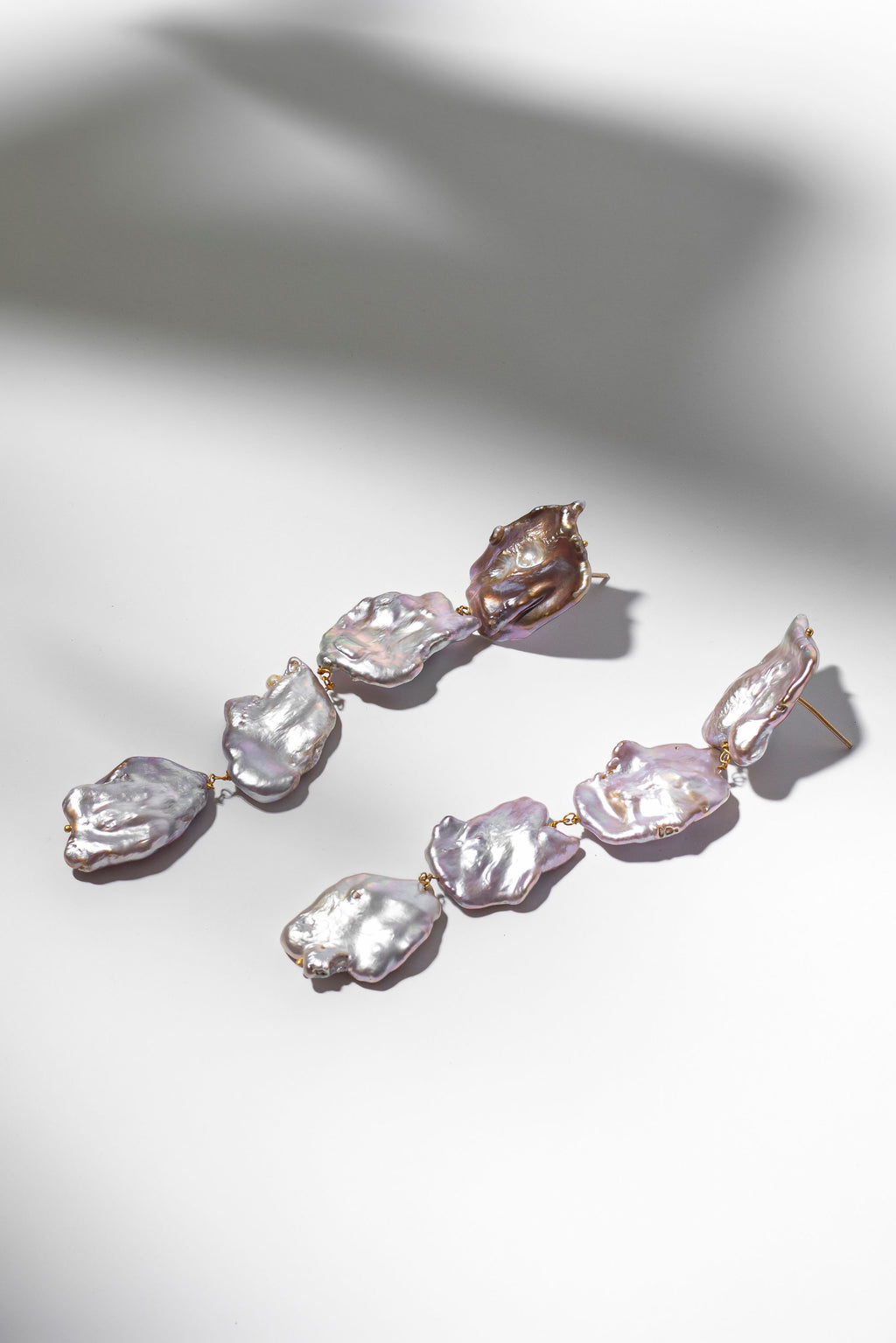 Long baroque pearl earrings