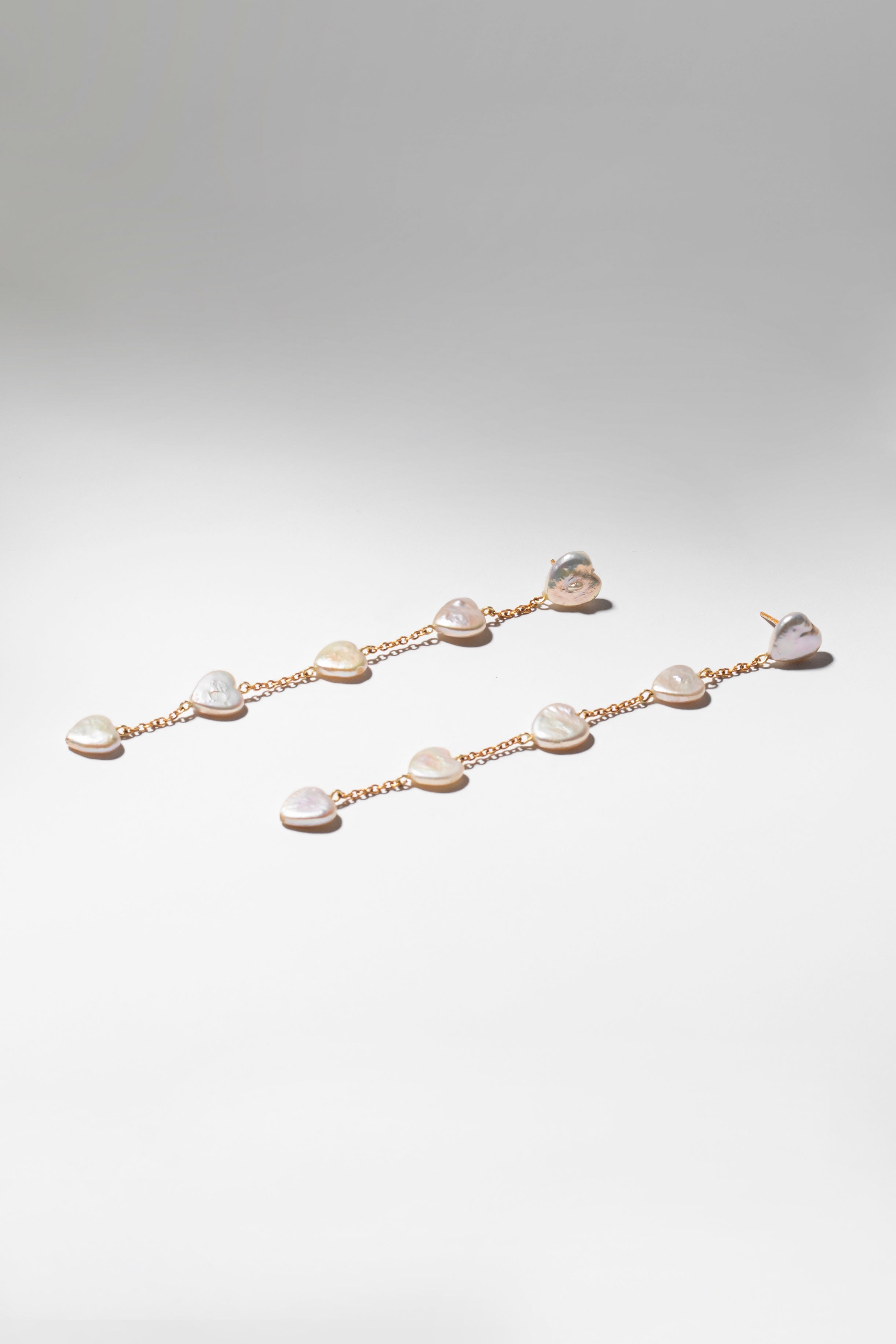 Heart shaped pearl waterfall earrings