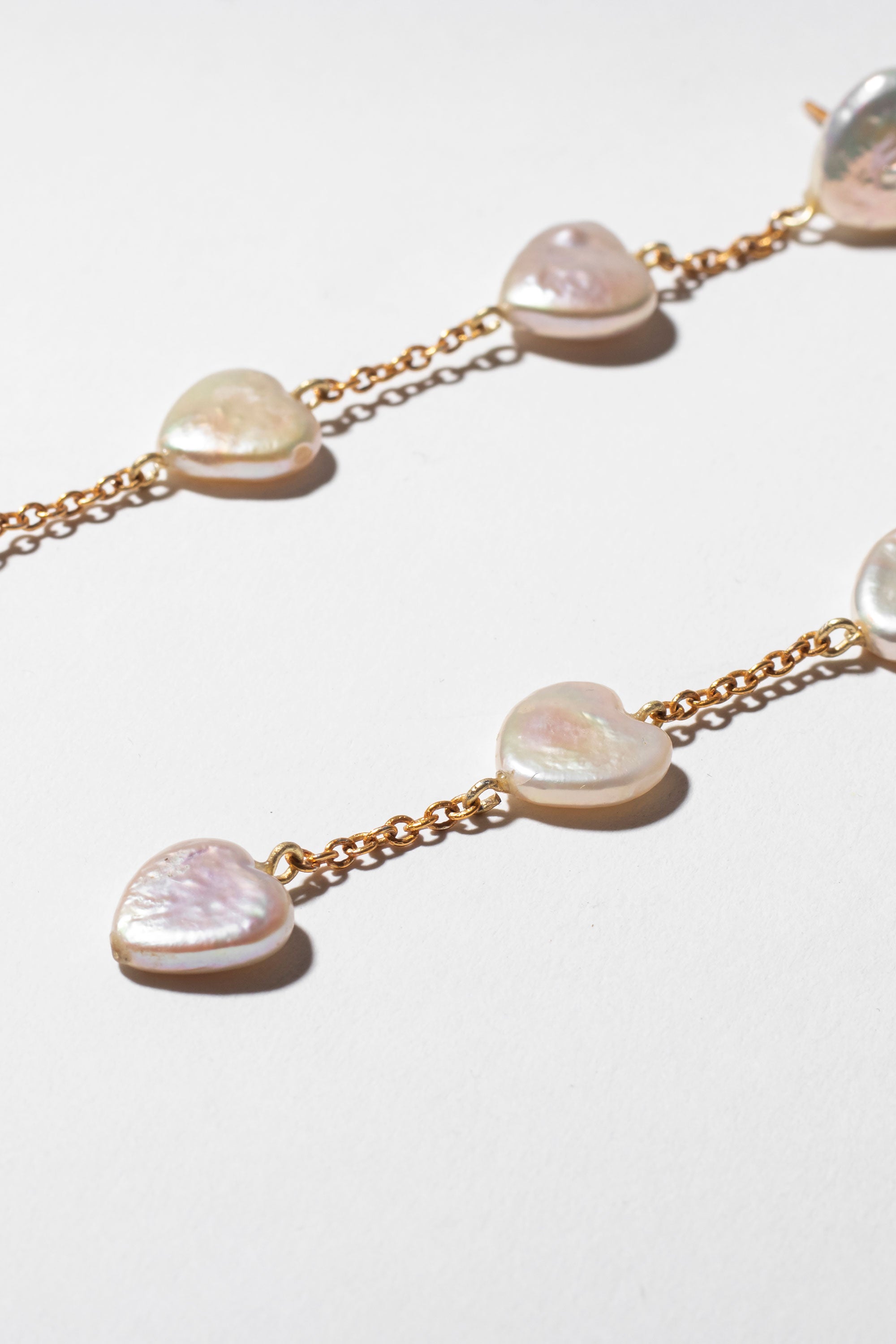 Heart shaped pearl waterfall earrings